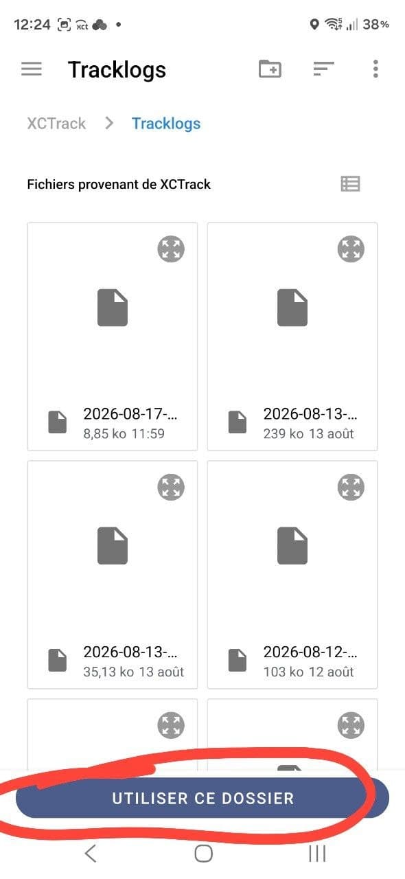 The Tracklogs folder showing dated flight files, with the "Use this folder" button circled